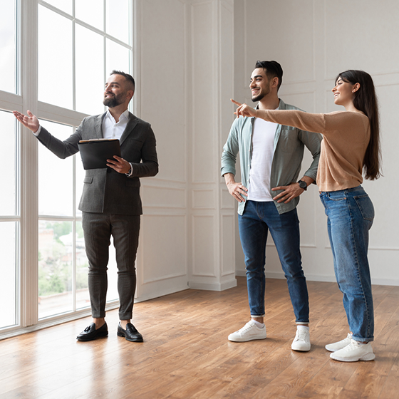 Couple looking at a new house with a realtor