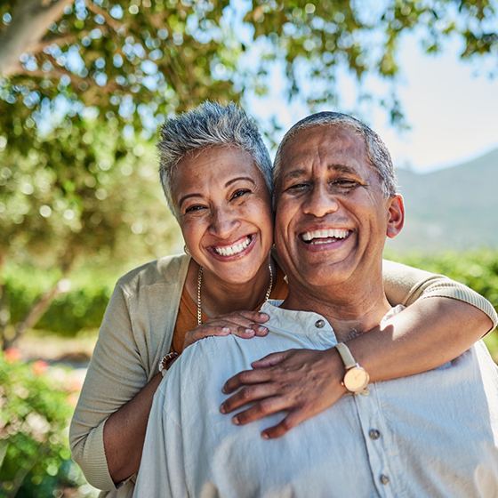 retired couple posing for a picture