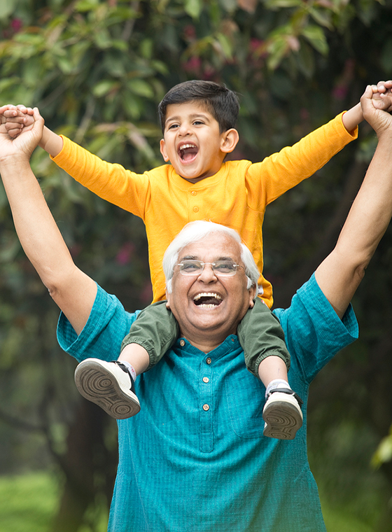 Grandparent with their grandkid on their shoulders