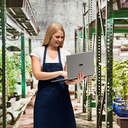 Woman working in her greenhouse 