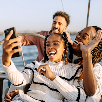 Family sailing and taking selfies