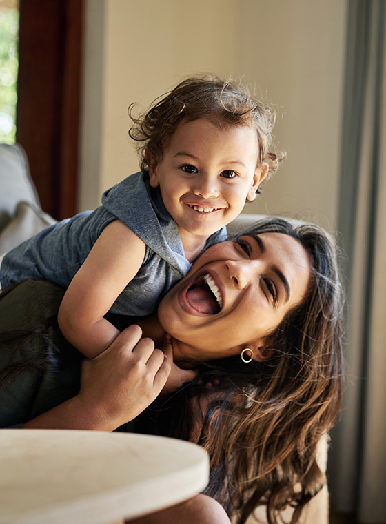 Woman plays with her daughter