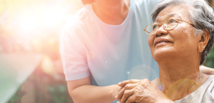 Elderly couple holding hands