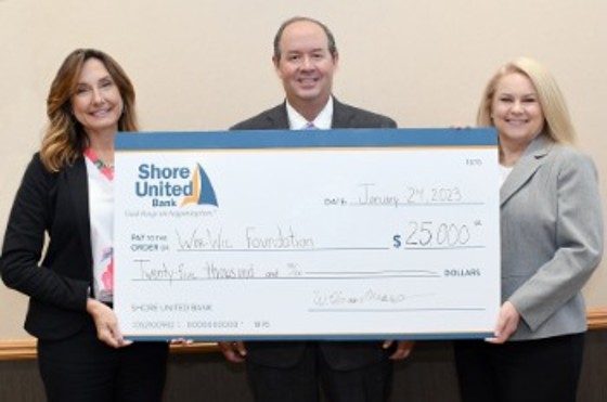 Shore donating money to the Worwic Foundation