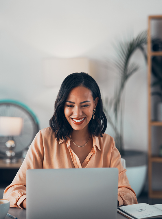 Woman typing on her laptop