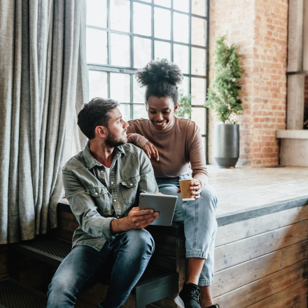 couple looking at tablet