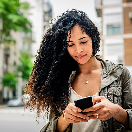 A woman messaging on her mobile phone