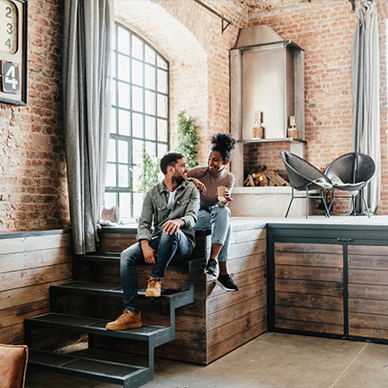 Couple sitting in their loft 