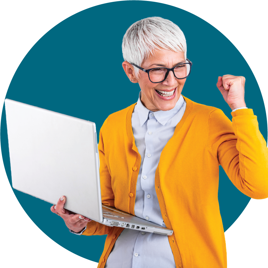 woman celebrating while holding a laptop
